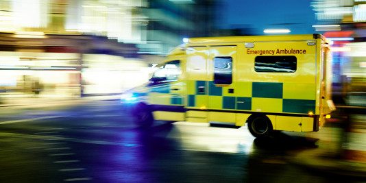 Night-time image of speeding ambulance in the U.K.